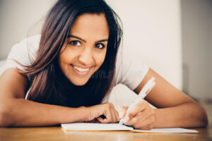 happy indian woman student education writing studying young 30542859 300x200 - انجام رساله دکترا اهواز | مشاوره انجام رساله دکتری در اهواز