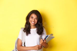 portrait happy african american female college student holding notebooks backpack smiling standing over yellow 203196190 300x200 - مقاله علمی در دنیای امروز چقدر اهمیت دارند؟
